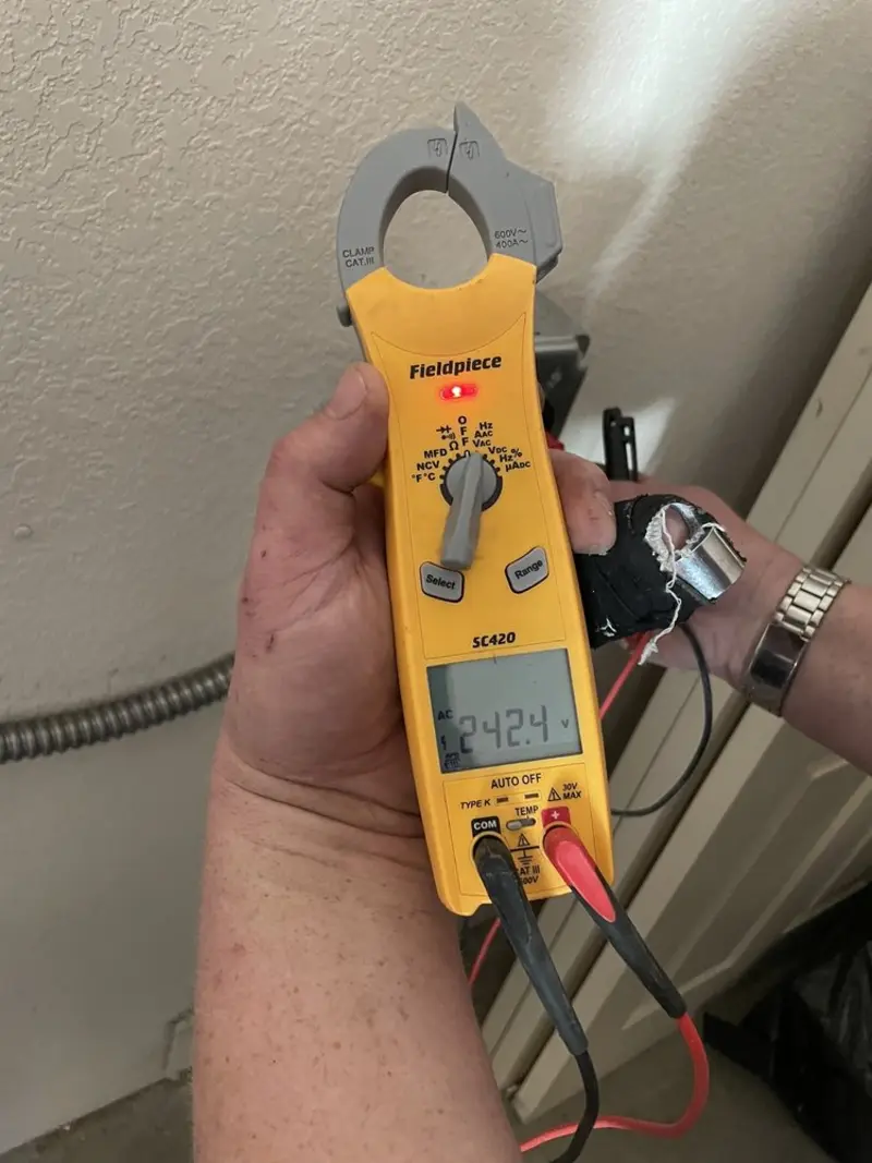 Voltage testing with clamp meter during Outlet Installation in Hillsboro